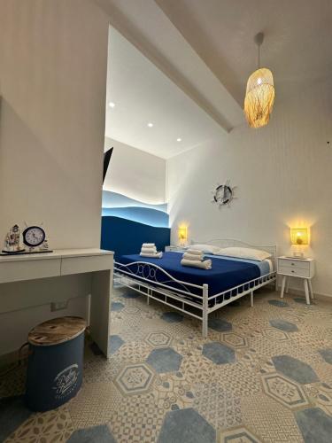 Ένα ή περισσότερα κρεβάτια σε δωμάτιο στο Le Case del Marinaio
