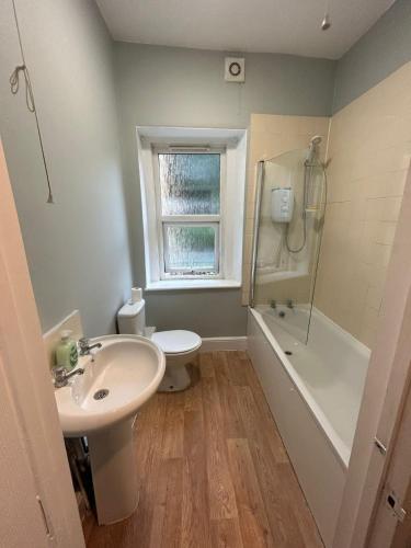 a bathroom with a sink and a toilet and a shower at High Street House in Bath