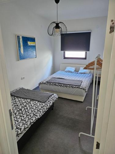 Postel nebo postele na pokoji v ubytování Vila lake