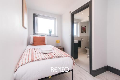 a bedroom with a bed and a mirror at Central 2 Bed Apartment in Derby by Renzo, Free Wi-Fi, Ideal for contractors in Derby