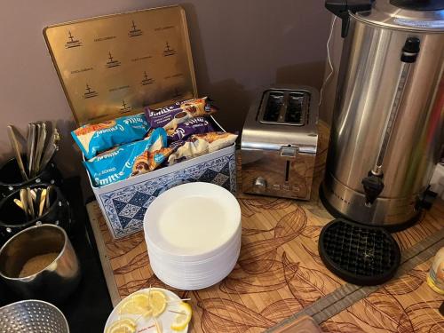 a counter top with a pile of food and a blender at Villa Ventana Poznań City Free Parking Śniadanie w Cenie in Poznań