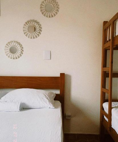 Ένα ή περισσότερα κρεβάτια σε δωμάτιο στο Alma de Maré Hostel