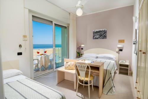 Posteľ alebo postele v izbe v ubytovaní Hotel Astoria