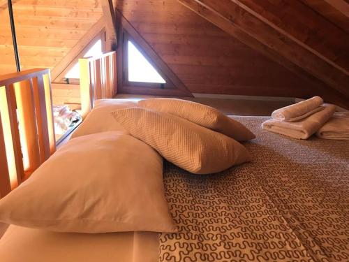 a bedroom with two pillows on a bed at Cozy Mountain Chalet in La Orotava
