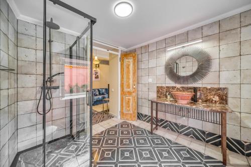 a bathroom with a shower and a mirror at Casa Riad Yasmin in Silves