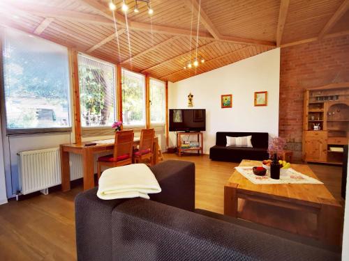 a living room with a couch and a table at Ferienwohnung life is life in Boltenhagen