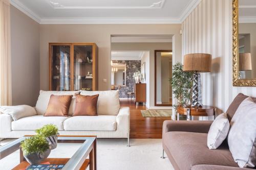 a living room with a couch and a table at Casa Olimpo by Homie in Estreito de Câmara de Lobos