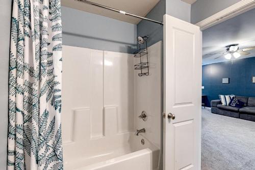 a bathroom with a shower and a bath tub at Greene Haven in Atlanta