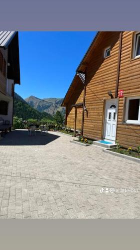 a building with a white door in front of it at Villa Te Ibra - Rugovë in Peje
