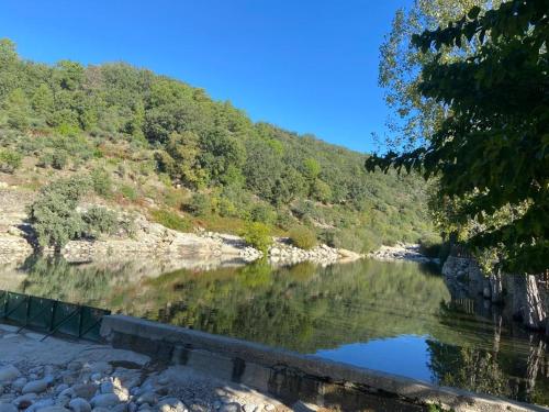 a view of a river from a bridge at Las Casas de Lola in Candeleda