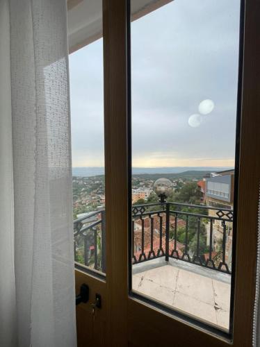 a window with a view of a city at --HOTEL DEAL-- Rooms With Castle View in Krujë