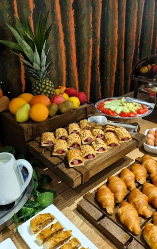 a buffet with various types of pastries and fruit at Hotel Santiny in Sveta Nedelja