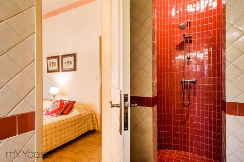 a bathroom with a shower and a bedroom with a bed at Quinta Azul - Gorgeous Apartment with Pool & Private Terrace in Lagoa