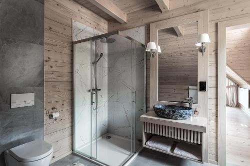 a bathroom with a glass shower and a sink at Dom Bio - Unique Ski Chalet, Białka Tatrzańska, Slovakia, Zakopane in Białka Tatrzanska