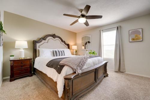 a bedroom with a bed and a ceiling fan at Brandon Condo with Balcony, Strip and Mountain Views! in Branson