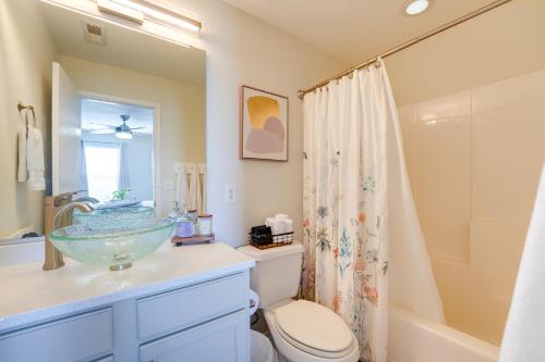 a bathroom with a sink and a toilet and a shower at Vineyards Retreat Branson Strip and Mountain Views! in Branson