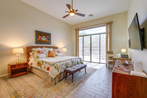 a bedroom with a bed and a tv and a window at Phoenix Vacation Rental Near Golf and Shopping in Phoenix