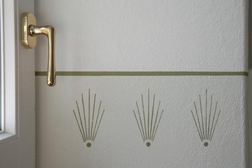 a door with a gold handle on a bathroom door at Villa Anna in Solda