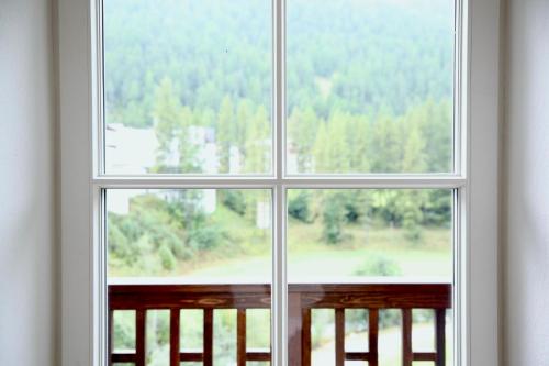 a window with a view of a forest at Villa Anna in Solda