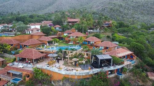 an aerial view of a resort with a swimming pool at Cala Margarita Hotel in Paraguachi