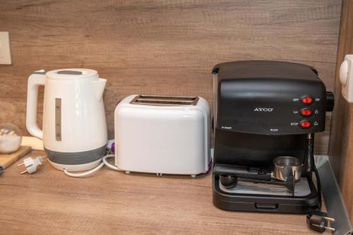 a coffee maker and toaster sitting on a counter at All Seasons Apartments Iglika 2 in Borovets