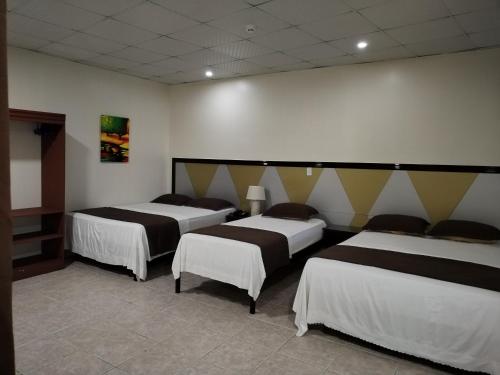 Katil atau katil-katil dalam bilik di Hotel America - La Chorrera