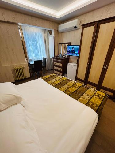 Postel nebo postele na pokoji v ubytování Lily Rooms