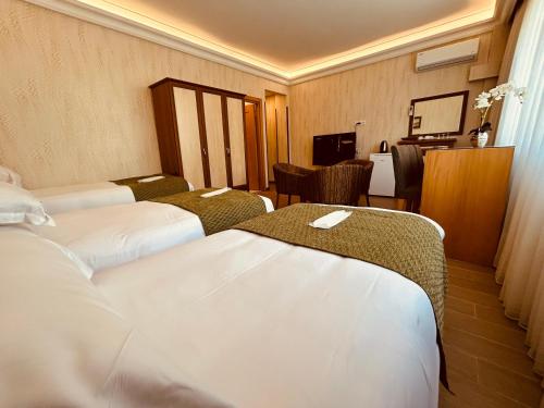 Postel nebo postele na pokoji v ubytování Lily Rooms
