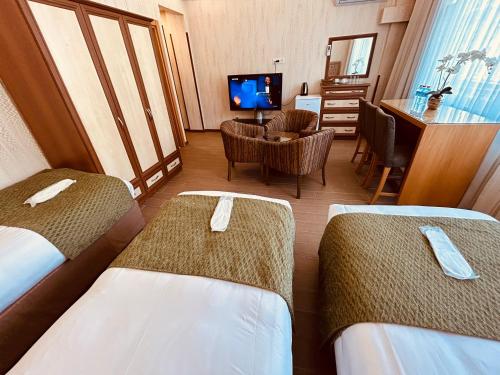 Postel nebo postele na pokoji v ubytování Lily Rooms