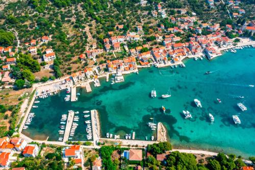 an aerial view of a harbor with boats in the water at Villa Marceline in Prvić Luka