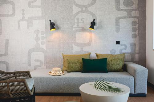 a living room with a couch and a table at Le Tahiti by Pearl Resorts in Papeete