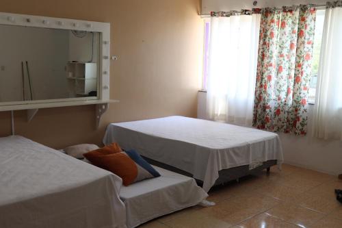 Een bed of bedden in een kamer bij Casa em Caragua