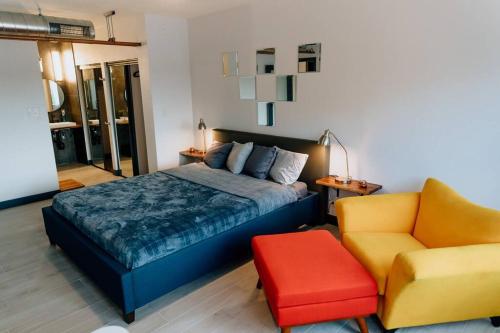 a bedroom with a bed and a chair at *Msg for 5%off*2Bed2Bath KingBeds MidtownPHX Condo in Phoenix