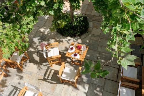an overhead view of a table and chairs on a patio at Hotel Leto Hydra in Hydra