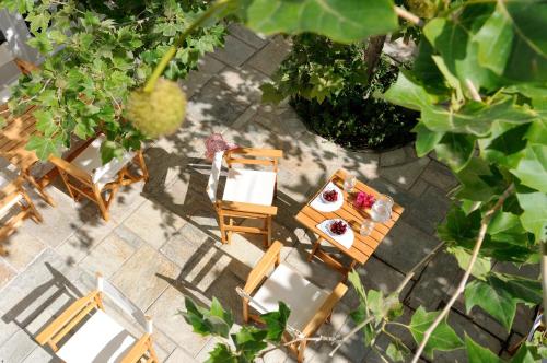 an overhead view of a table and chairs with food on it at Hotel Leto Hydra in Hydra