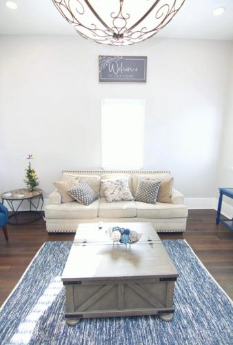 a living room with a couch and a coffee table at Treme Treasure in New Orleans