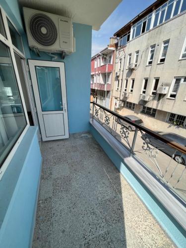 a balcony with a white door and a balcony at Maritsa Comfort Plus in Edirne