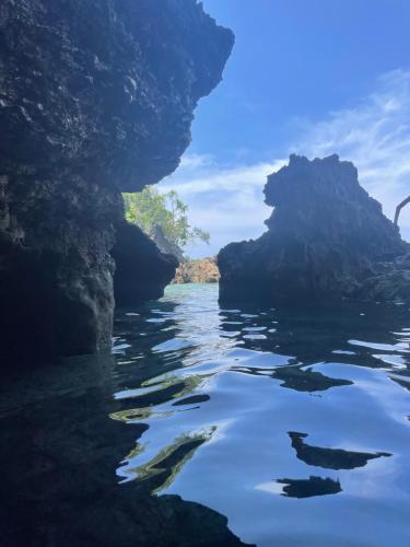 a view of a river with rocks in the water at La Maison Guesthouse in Manlocahoc