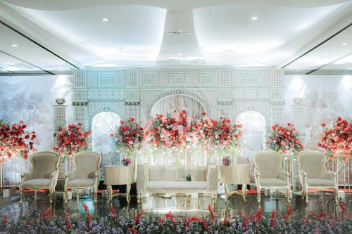 a room with a table and chairs and flowers at Crowne Plaza Bandung by IHG in Bandung