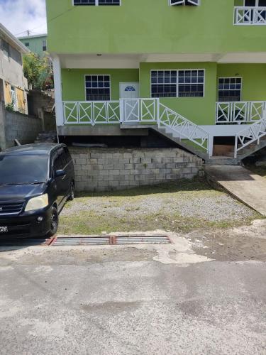 a car parked in front of a building at Lovely and cozy 2 bedroom apt with oceanic view in Roger