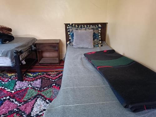 Ein Bett oder Betten in einem Zimmer der Unterkunft Auberge Toubkal Amsouzart Aitst Idar