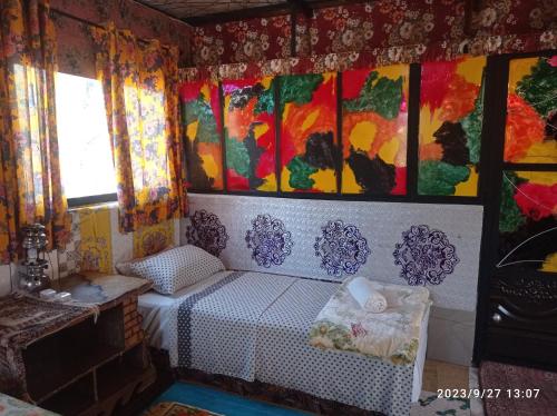 Ein Bett oder Betten in einem Zimmer der Unterkunft Maison d'hotes Ait Bou Izryane