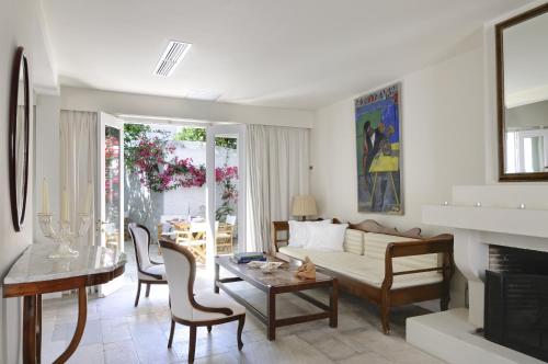 a living room with a couch and a table at Hotel Leto Hydra in Hydra
