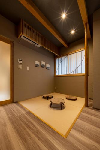 a large room with a table in the middle of it at 媛邸【ＥＮＴＥＩ】 in Matsuyama
