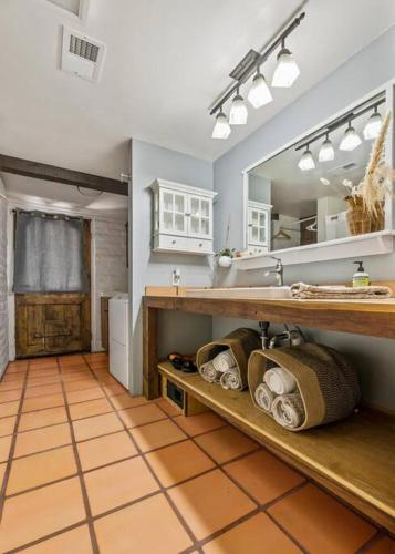 a bathroom with a sink and a mirror at Scenic Spanish Rancho - Breathtaking Views in Three Rivers