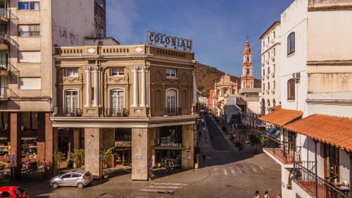 an old building on a street in a city at Hotel Colonial Salta in Salta