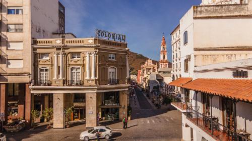 a view of a street in a city with buildings at Hotel Colonial Salta in Salta