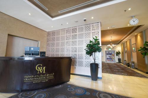 a lobby with a reception desk in a building at Grand Majestic Hotel Kuwait in Kuwait