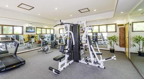 a gym with treadmills and elliptical machines at Fiji Gateway Hotel in Nadi