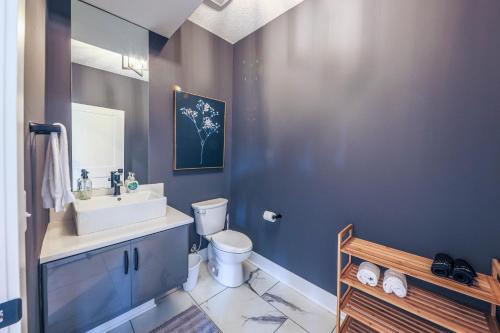 a bathroom with a sink and a toilet at Luxury Getaway at The Village in Columbus